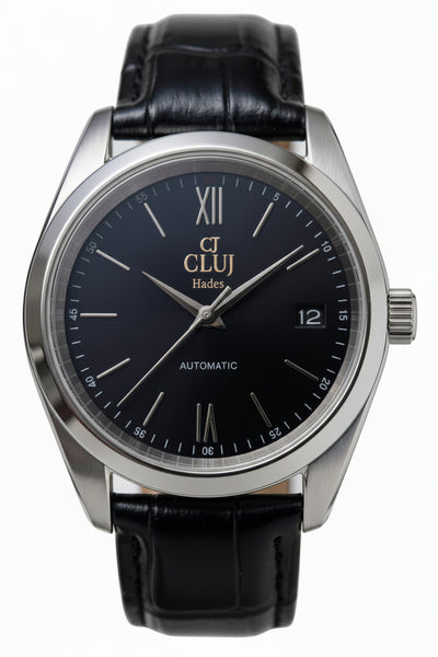 A close-up shot of a Cluj Hades automatic watch with a black dial, silver stainless steel case, and a black leather strap, set against a plain white background.