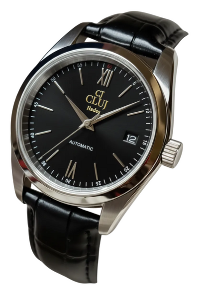 A wristwatch with a round silver-tone case, a dark gray dial featuring Roman numerals and a date window, and a black leather strap, shown on a plain white background.