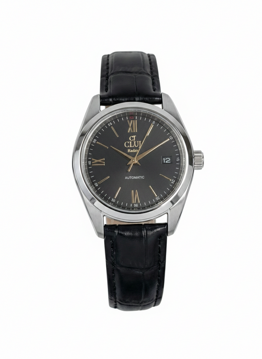 Black wristwatch with silver case and black leather strap on a white background